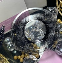 mink lashes in a glass container with crystals and diamonds