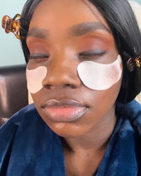 a woman with eye masks on her face